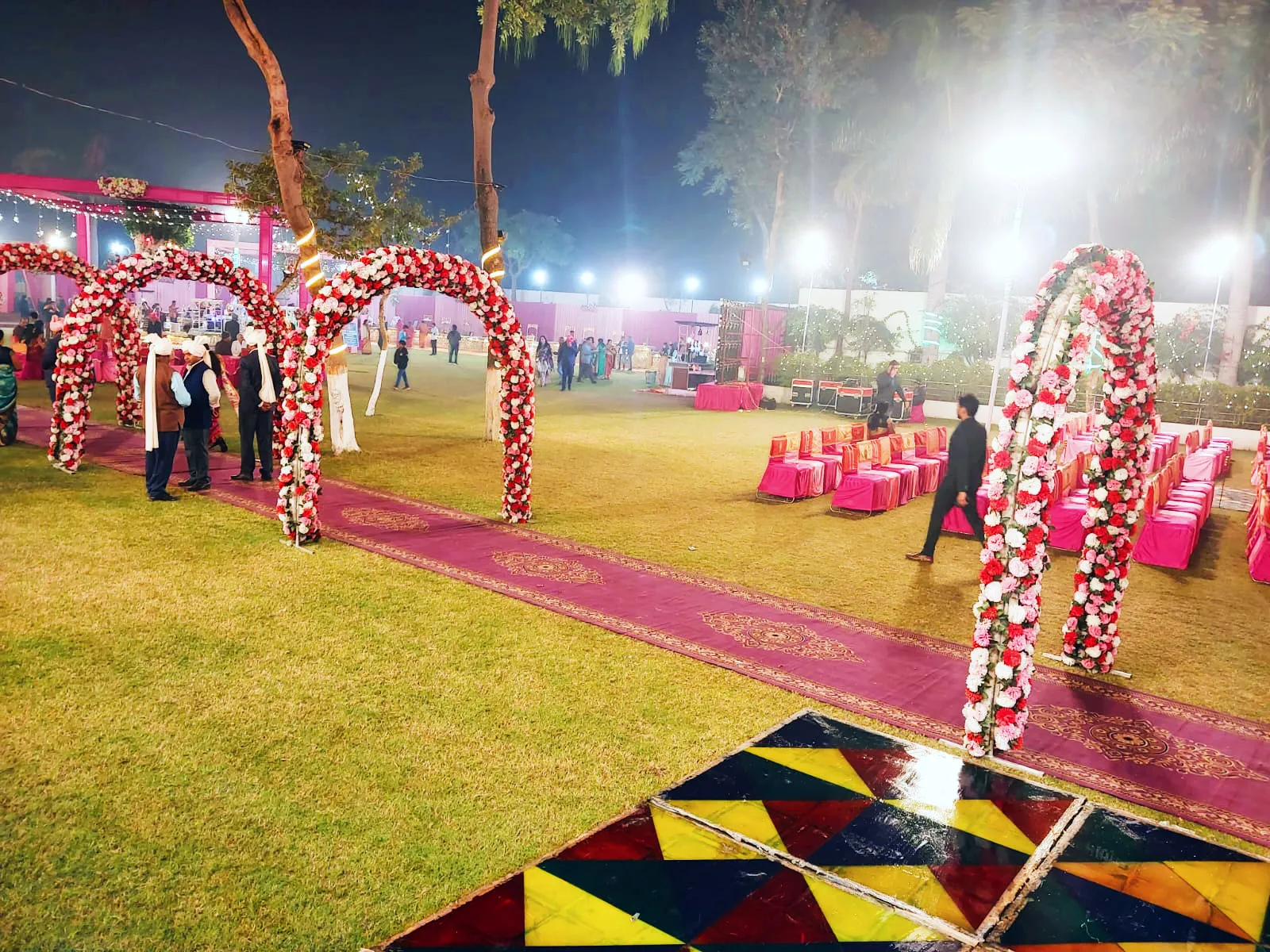 Flower arches set up across the garden for photos.