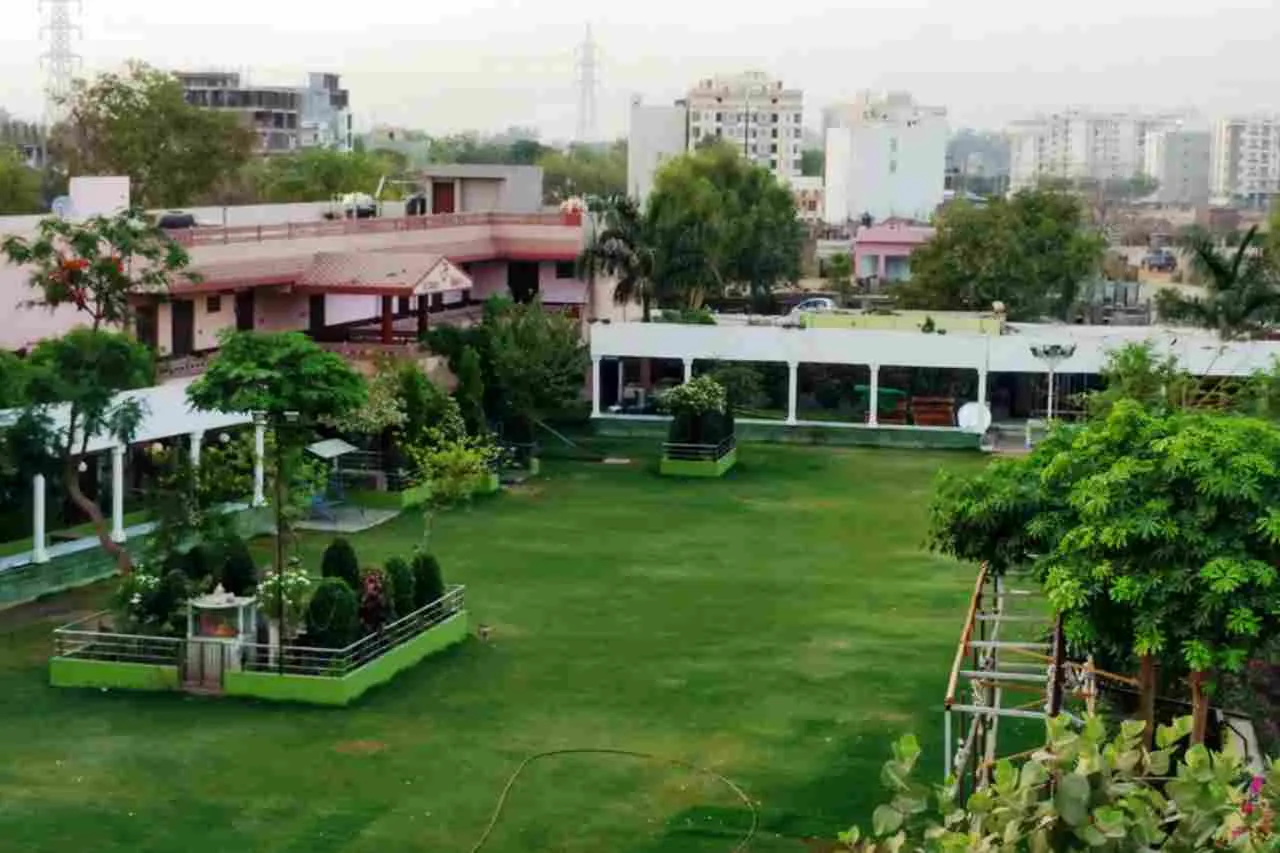 The lawn with the pavilion and walkway along one side.